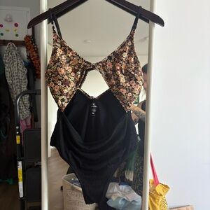 Rip Curl Black One-Piece Swimsuit with brown Floral Accents